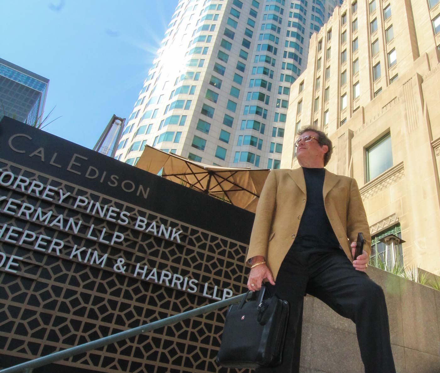 Tom Kurtz standing next to corporate building